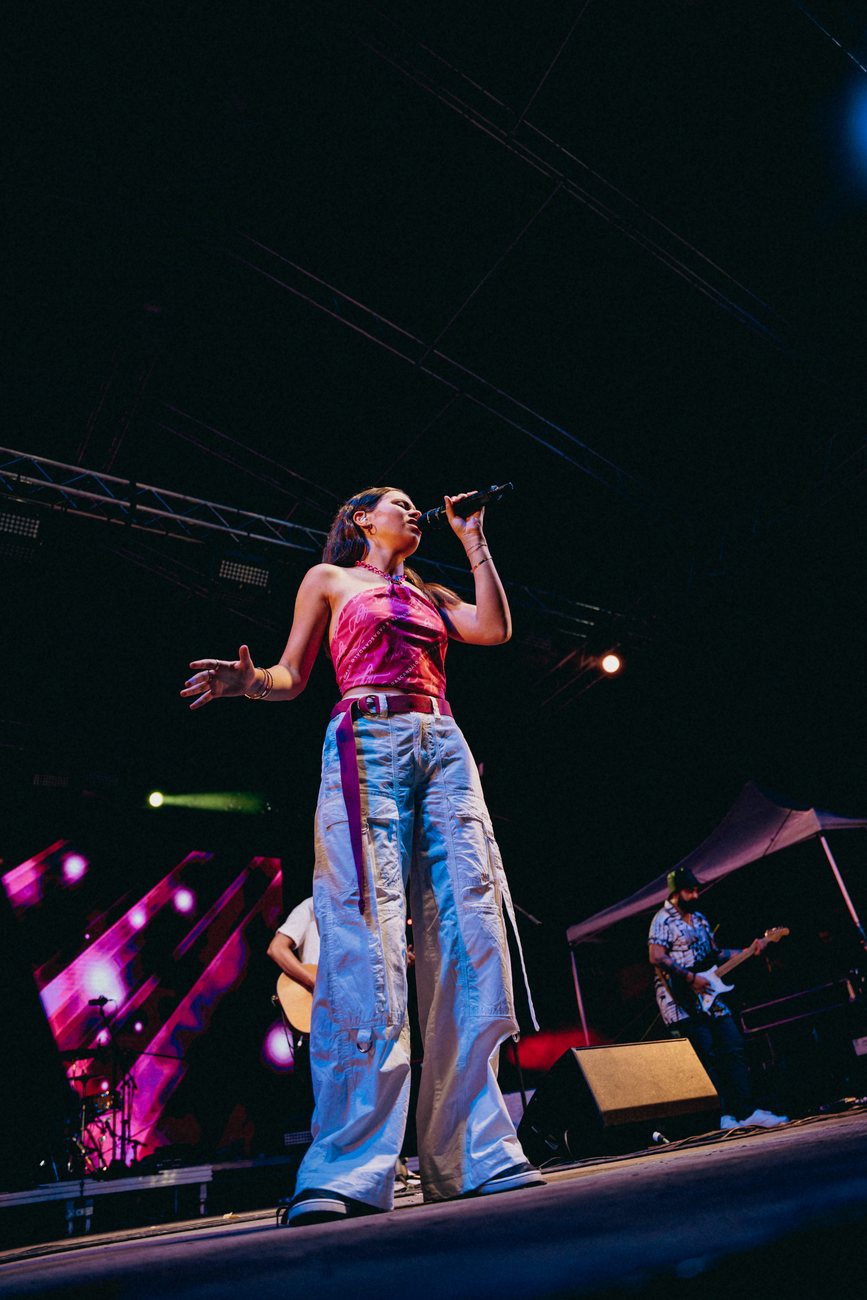 Lisa Gauci performing live at a festival